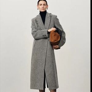 Sam Frenzel with Fabrique Sabine Asymmetric Fringed Wool Coat